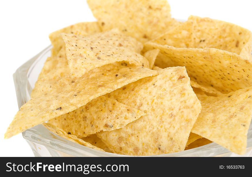 Tortilla chips isolated on white background in vase closeup.