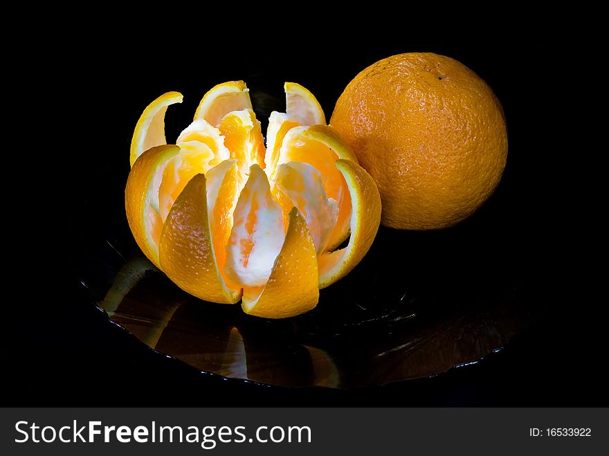 Two fresh oranges on a plate. Two fresh oranges on a plate