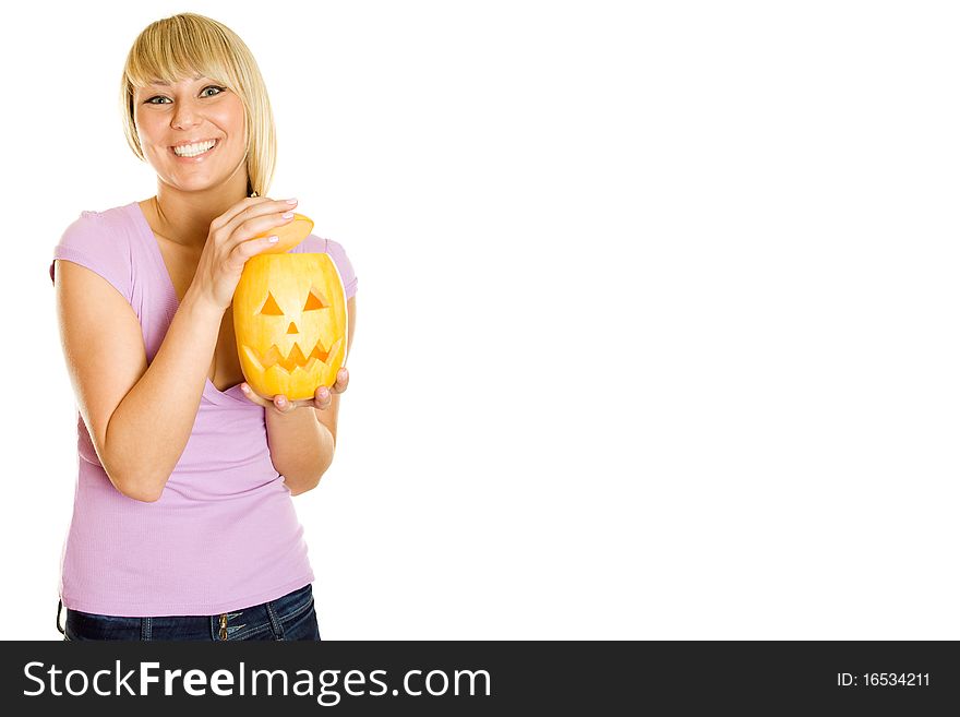 Young girl having fun with a pumpkin on Halloween. Lots of copyspace and room for text on this isolate