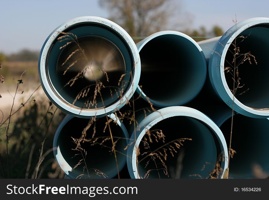 Close-up of a stack of main water line pipe. Close-up of a stack of main water line pipe.