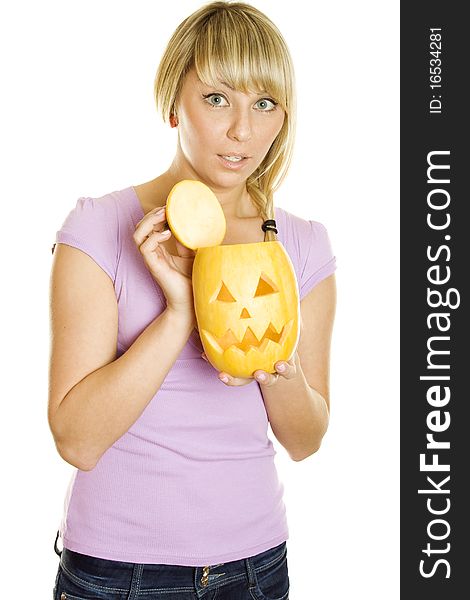 A young girl frightened with pumpkin for Halloween. Lots of copyspace and room for text on this isolate