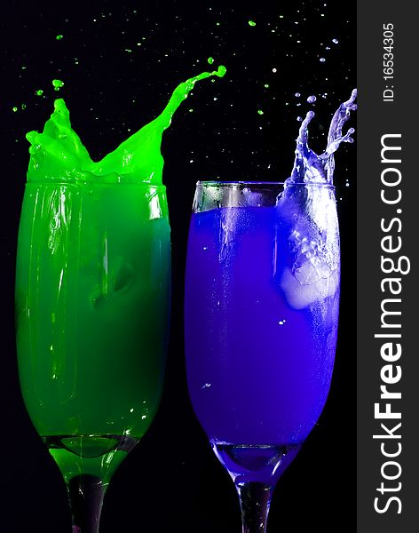 Colored drinks on black background. Colored drinks on black background