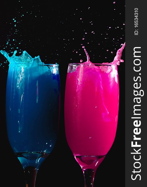 Colored drinks on black background. Colored drinks on black background