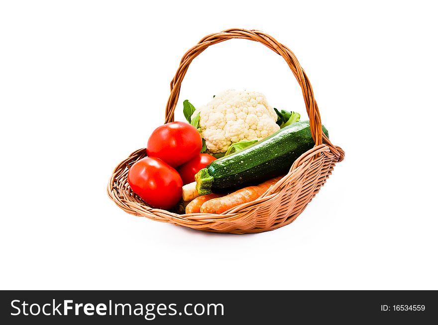 Wicker basket with fresh vegetables from the market. Wicker basket with fresh vegetables from the market