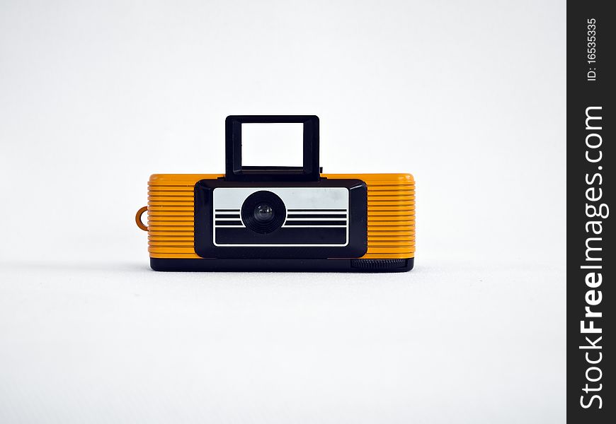 Yellow vintage classic camera isolate on background