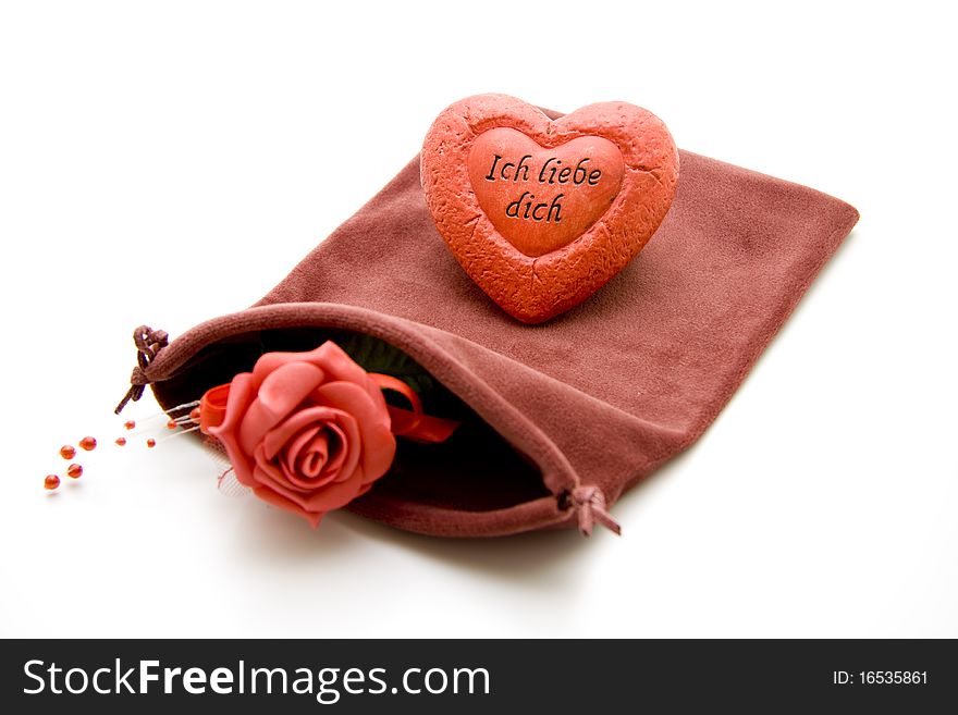 Red rose and heart onto material bags
