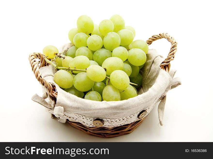 Bunches of grapes in the basket with material