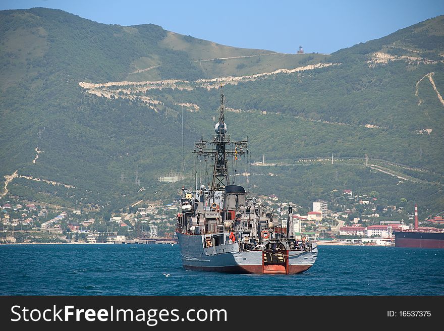 Ship Against The Wooded Mountains