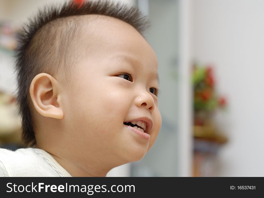 It is a cute chinese baby smiling face. It is a cute chinese baby smiling face.