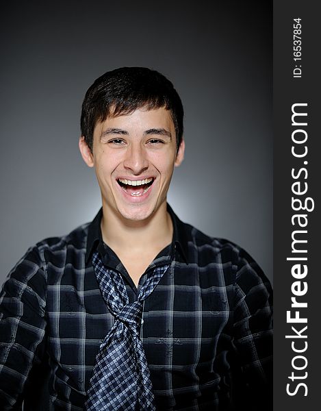 Expressions Handsome man in funny shirt and tie laughing. Expressions Handsome man in funny shirt and tie laughing