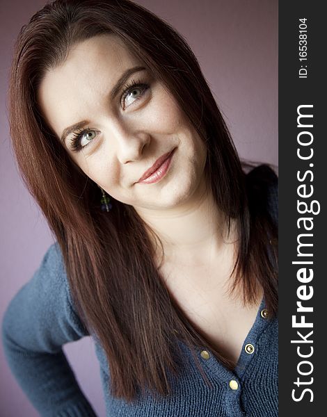 Beautiful woman portrait isolated on mauve background