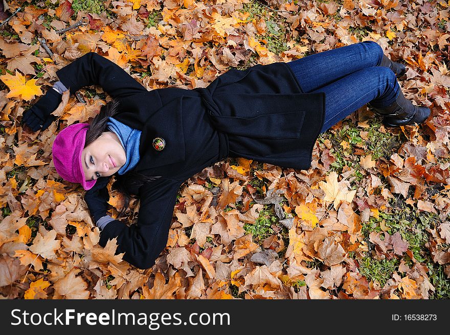 Pretty Autumn Girl Relaxing Outdoors In The Forest