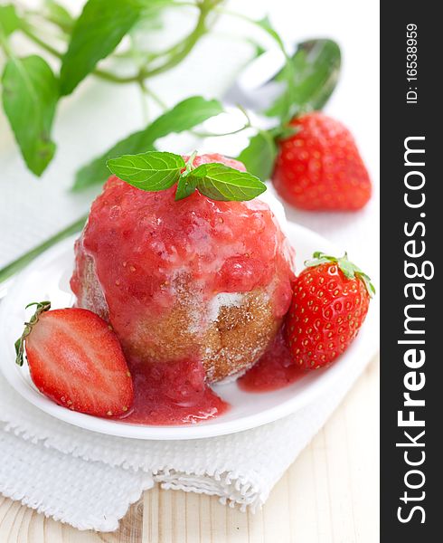 Fresh quark ball with strawberry sauce and mint