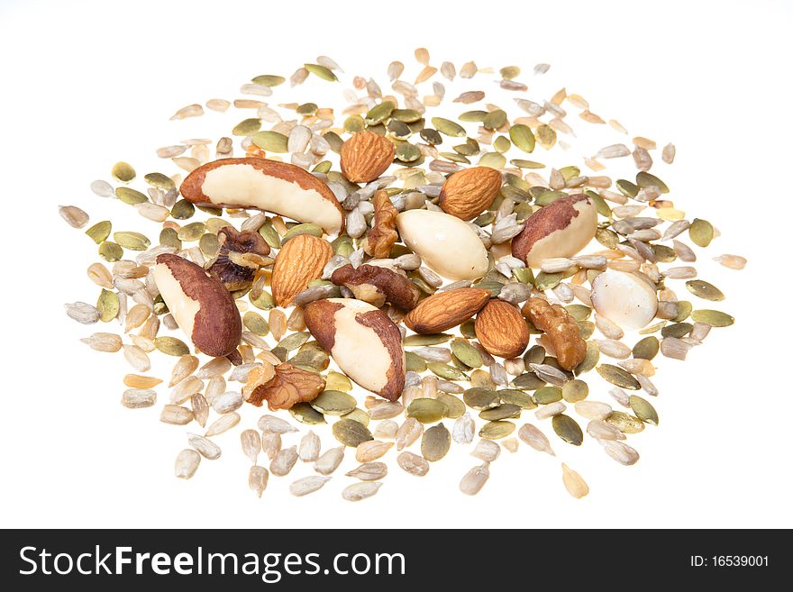 Selection of seeds, brazil nuts,almonds and walnuts on a white background. Selection of seeds, brazil nuts,almonds and walnuts on a white background