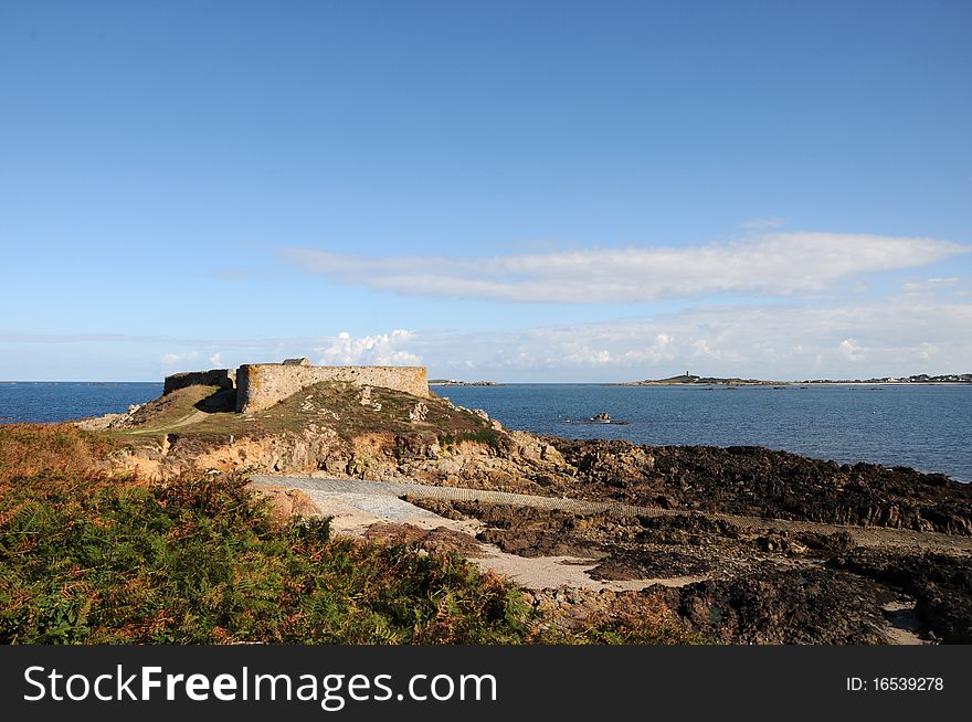 Ruined fortifications of a castle at Portelet harbour, Guernsey