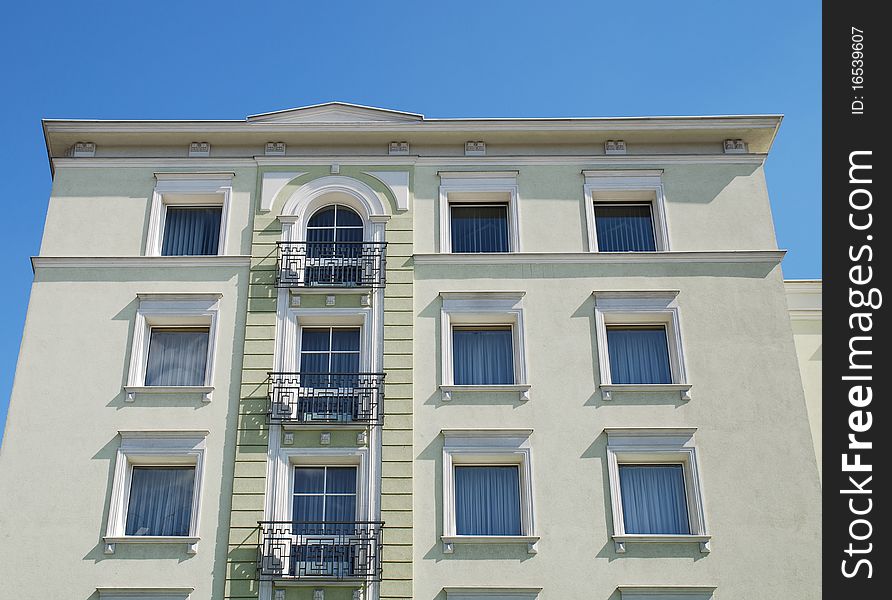 Fragment of the old building on the blue sky