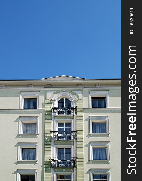 Fragment of the old building on the blue sky