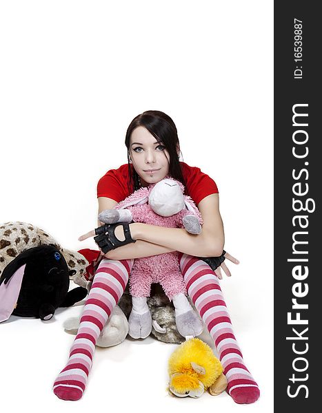 Young girl in pink socks with toy. Young girl in pink socks with toy