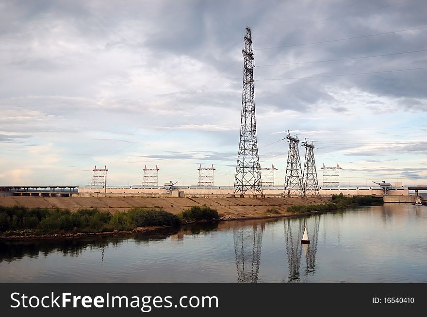Electrical towers on river bank of Volga river in Russia