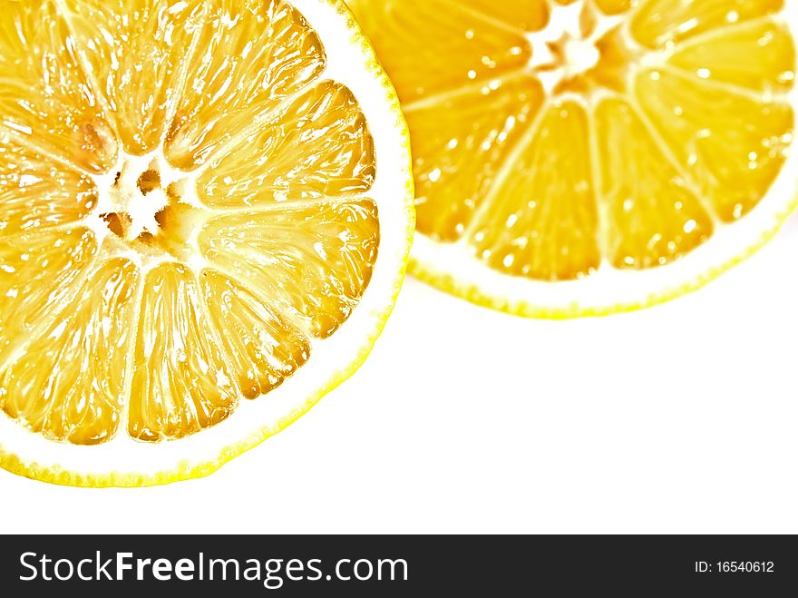 Two lemons cross section on white background