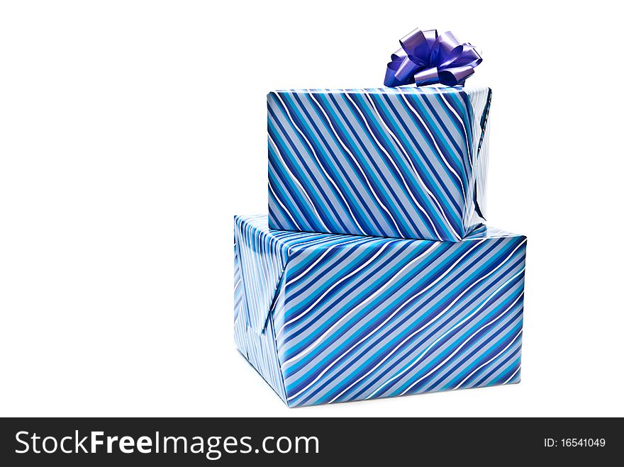 Two blue paper gifts boxes with bows. White background. Two blue paper gifts boxes with bows. White background