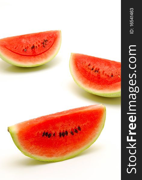Three slices of juicy watermelon on a white background. Three slices of juicy watermelon on a white background
