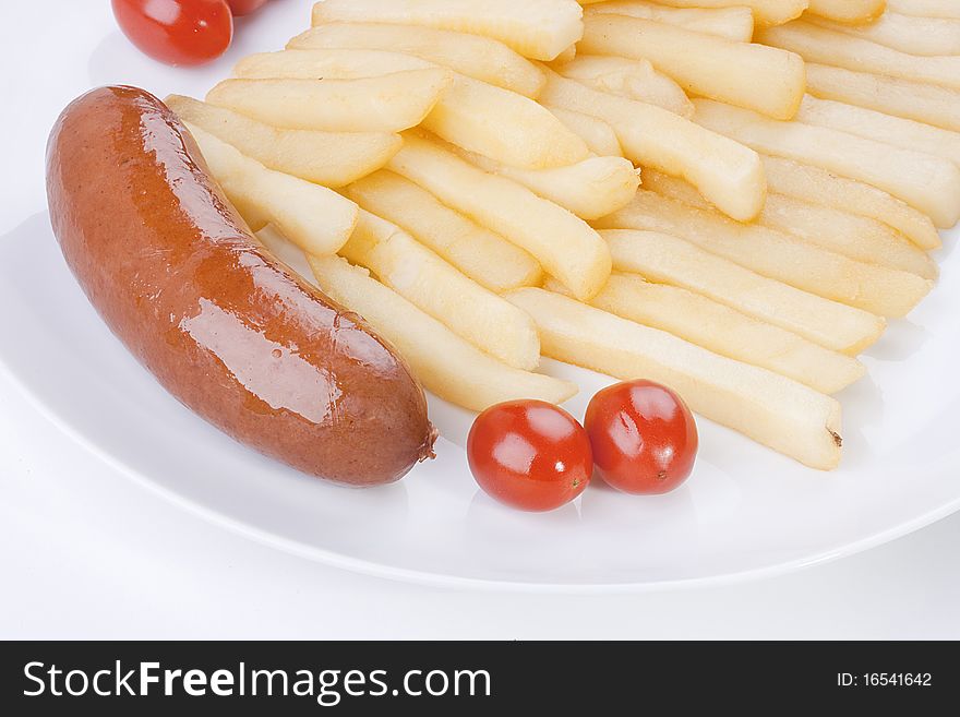 Sausage with a fried potato and tomatoes.