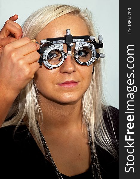 Young woman examining the eyesight