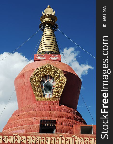 Scenery of a red buddhist stupa in Tibet,with blue skies as backgrounds. Scenery of a red buddhist stupa in Tibet,with blue skies as backgrounds.