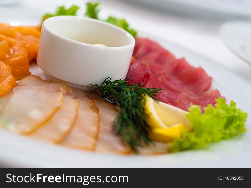 Assorted vegetables on a platter with sauce