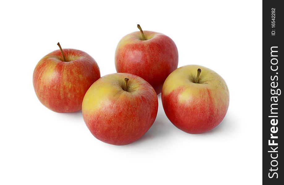 Four ripe juicy red apple on a white background