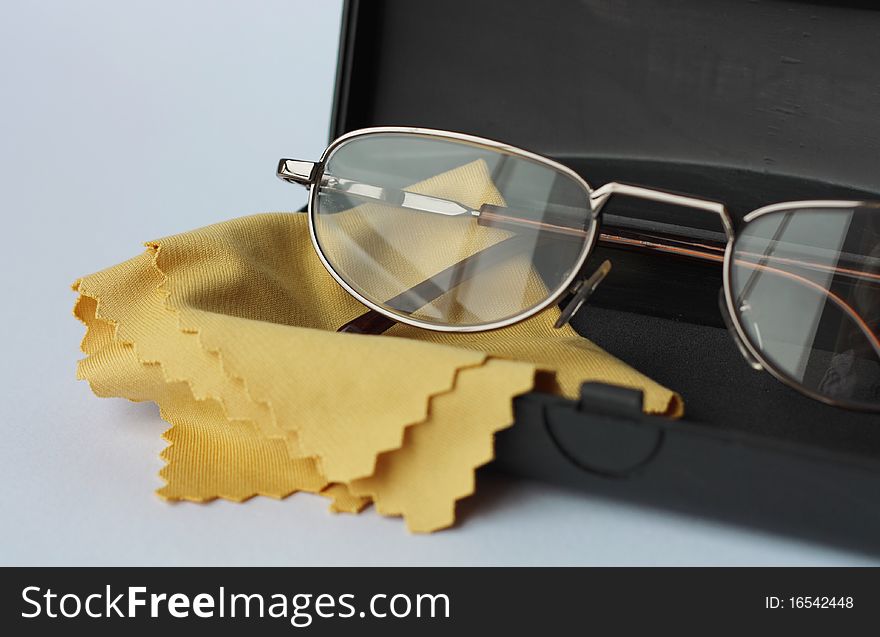 Glasses in black case on a white background