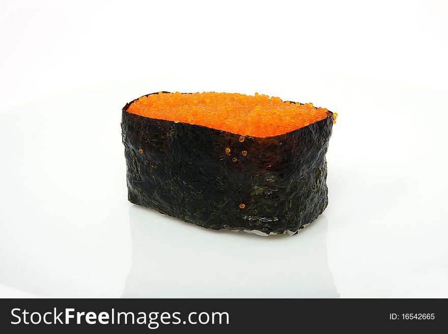 Red tobiko (flying fish roe) sushi closeup. Red tobiko (flying fish roe) sushi closeup