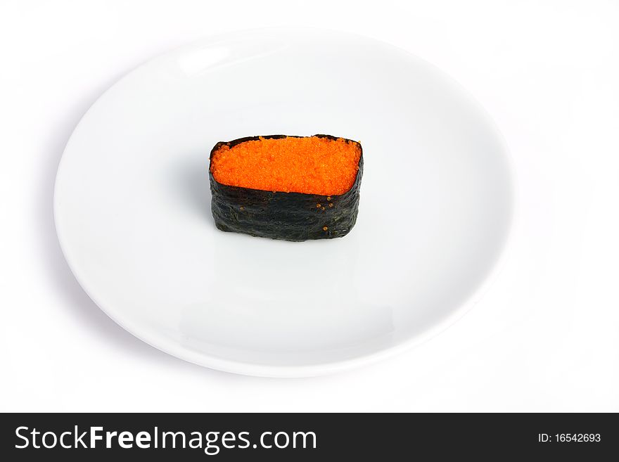 Red tobiko (flying fish roe) sushi closeup. Red tobiko (flying fish roe) sushi closeup