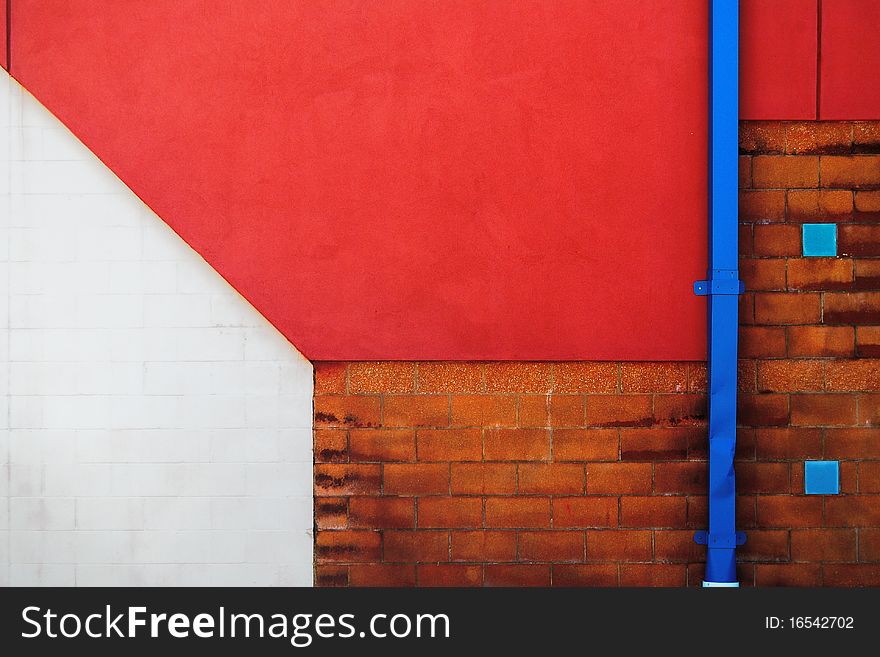 Detail of a colorful building wall with downspout. Detail of a colorful building wall with downspout
