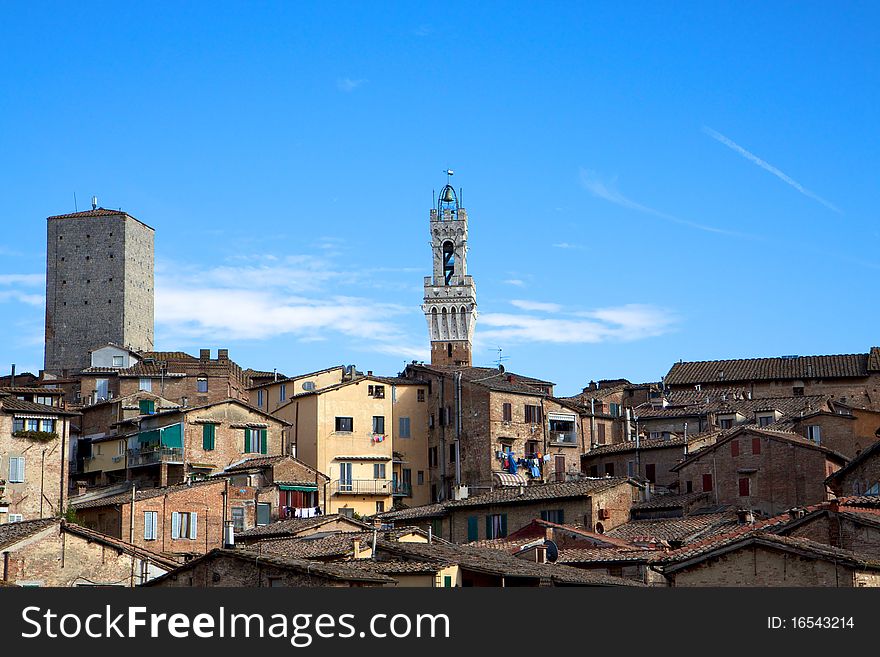 Rooftops and the Torre del Mangia Tower in Siena, Italy. Rooftops and the Torre del Mangia Tower in Siena, Italy