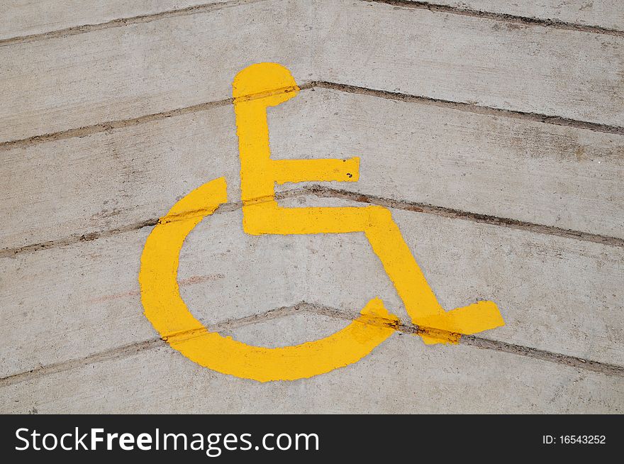 Yellow Wheel Chair Sign On The Floor