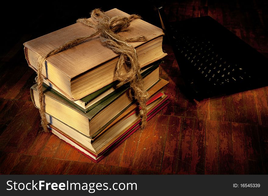 Sheaf of books on old wooden to a floor. Sheaf of books on old wooden to a floor