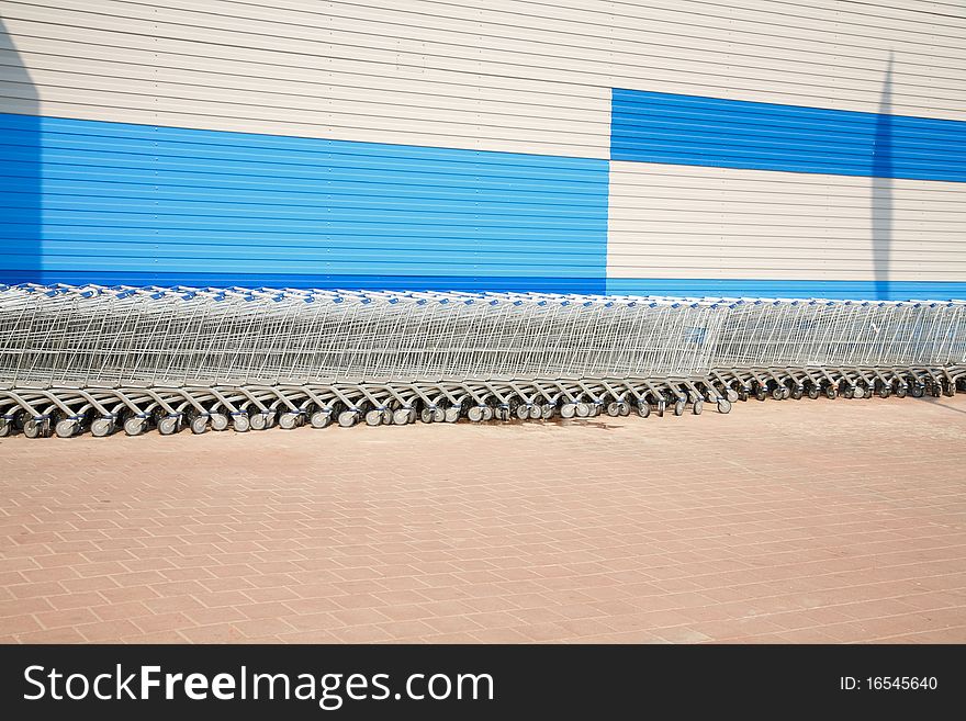 Stacked shopping carts. Equipment supermarket