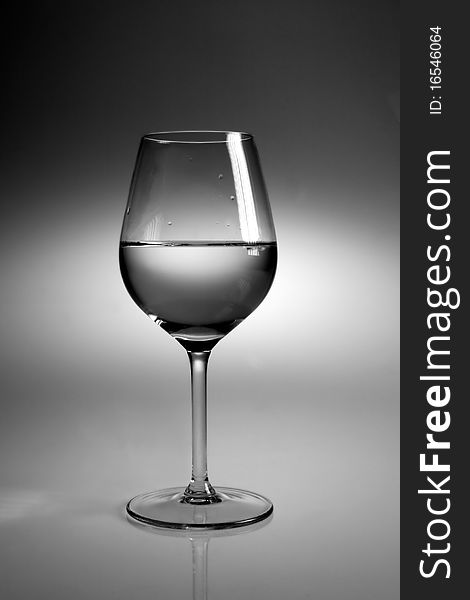 Glass of water on neutral background