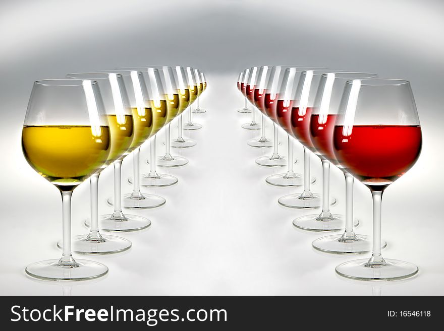 Geometry of double raw of glasses with red and white wine