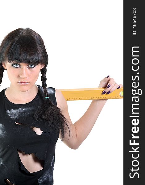Girl in a ragged t-shirt hold a yellow ruler. Girl in a ragged t-shirt hold a yellow ruler