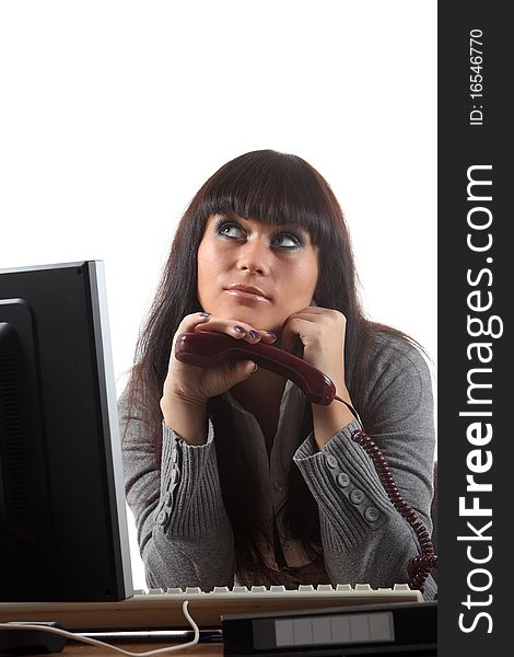 Businesswoman on her workplace with a phone. Businesswoman on her workplace with a phone