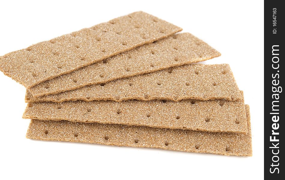 Slices of crispbread isolated on white background. It's good alternative for traditional bread.