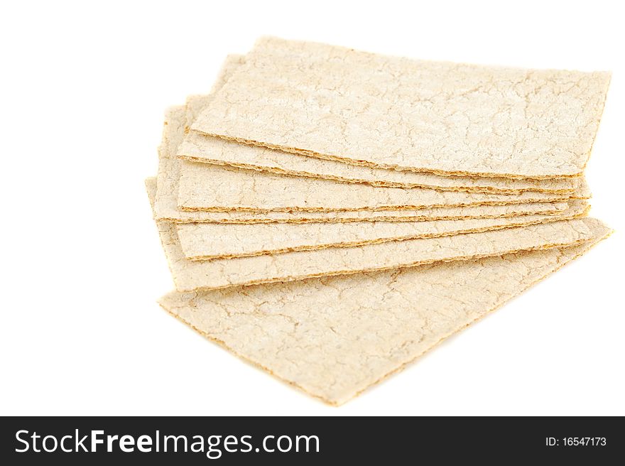 Slices of crispbread isolated on white background. It's good alternative for traditional bread. Original color.