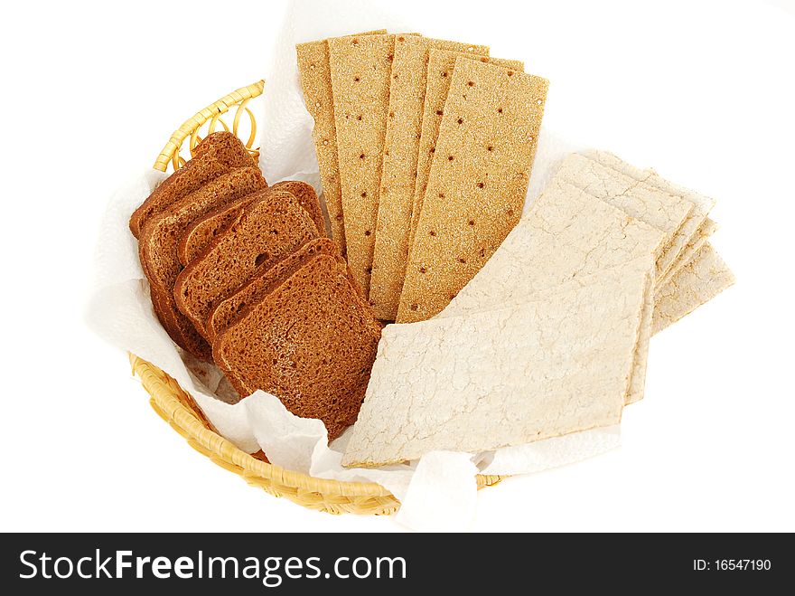 Three type of bread set in the basket isolated on the white background. Three type of bread set in the basket isolated on the white background.