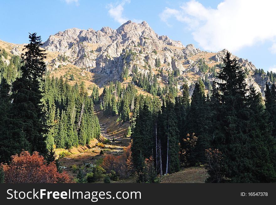 Mountain top in tien shan mountains near almaty kazakhstan on a sunny fall day. Mountain top in tien shan mountains near almaty kazakhstan on a sunny fall day