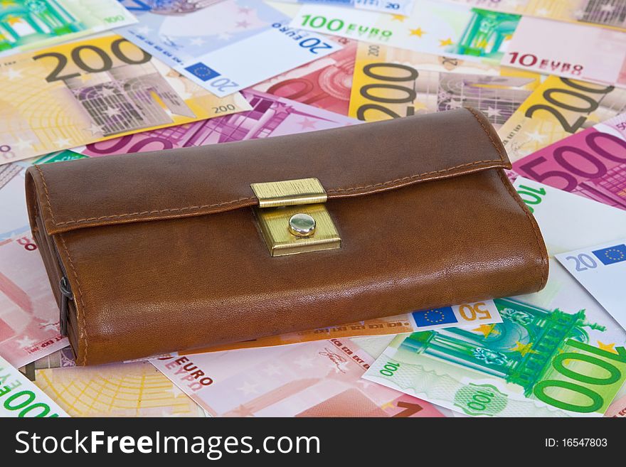 Purse with euro banknotes as background. Purse with euro banknotes as background