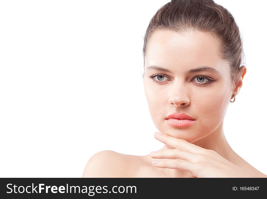 Dreaming brunette woman with fingers touching face