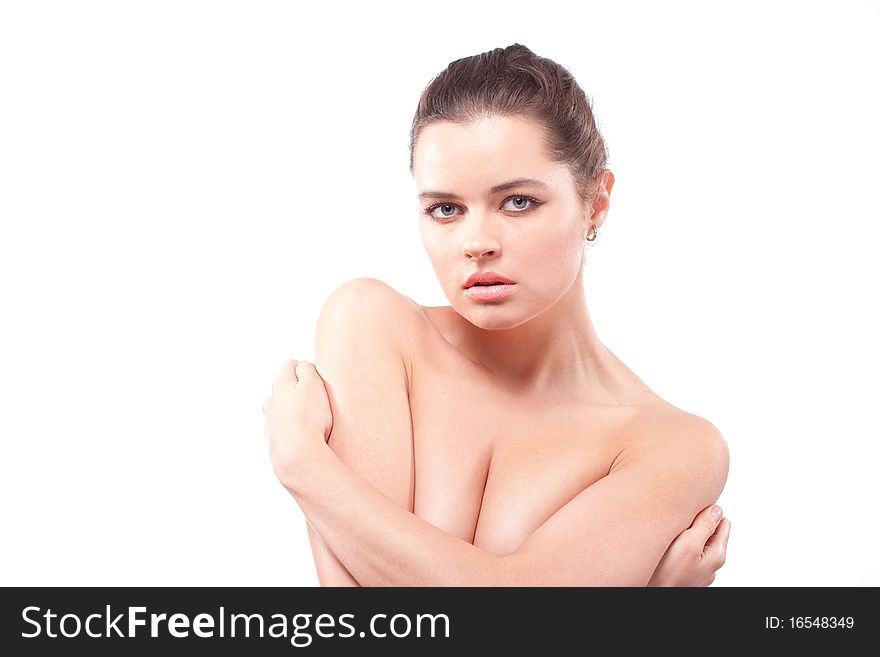 Lonely beautiful brunette woman embracing herself